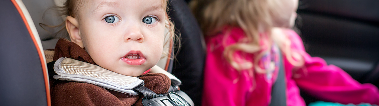 Young children in car with seatbelts