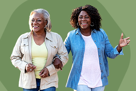 an elderly woman and her adult daughter joyfully walking arm and arm