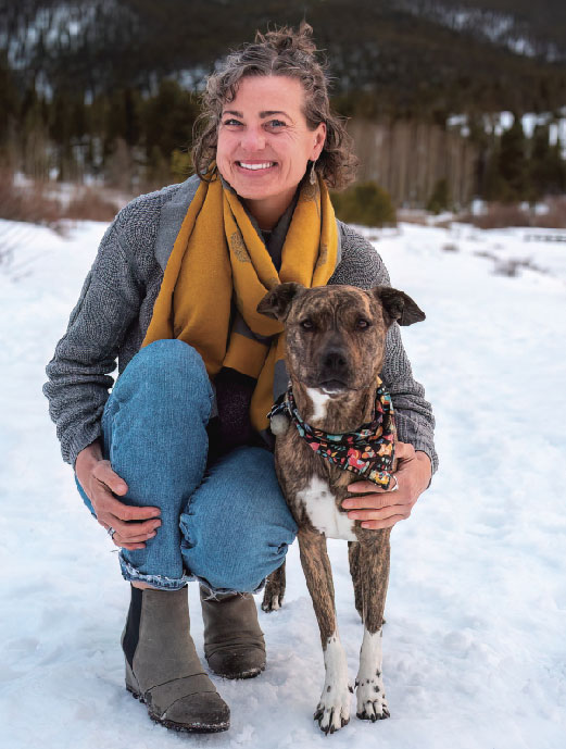 Lena Heilmann and her dog in the snow.